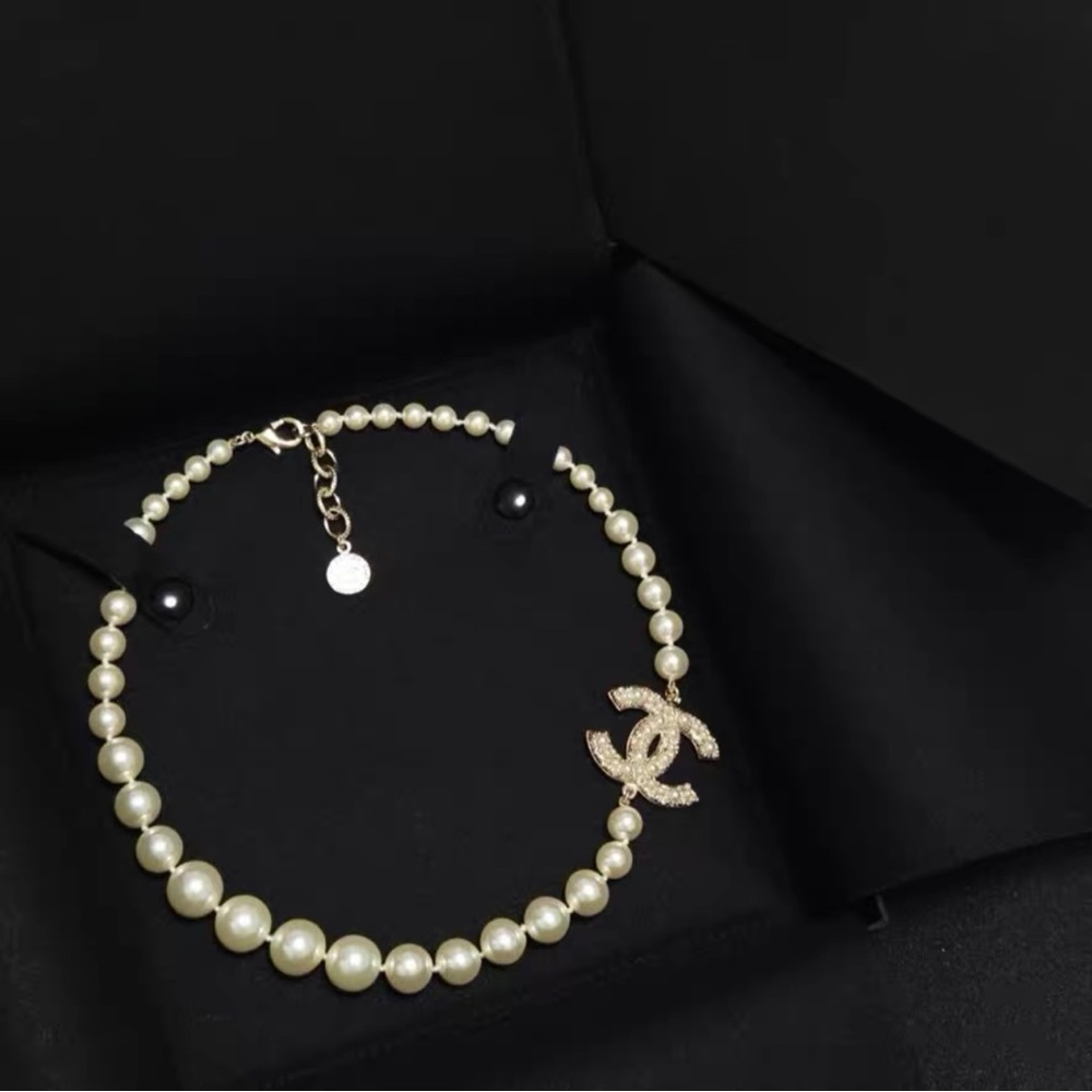 CHANEL Cream and Gold Necklace with Crystal Accent